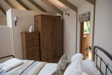 There is even a wardrobe and chest of drawers in this woodland yurt!