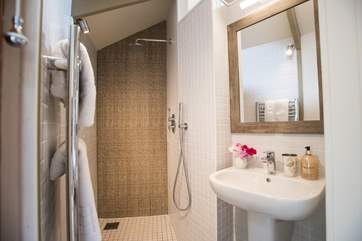Next to the king-size bed is the walk in wet-room.