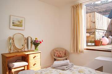 The double bedroom has steps up to the terrace.