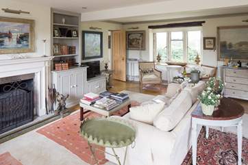 The drawing room has dual aspect windows, with the countryside in one direction and the garden in the other.