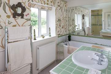 The master bedroom en suite has a lovely deep bath and separate shower cubicle.