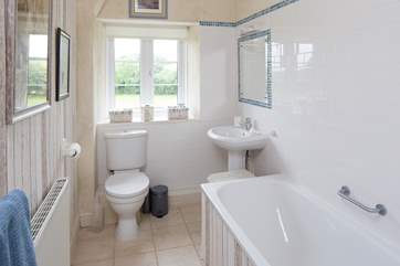 The en suite bathroom for bedroom 2 has a bath and shower cubicle.