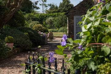 This elegant farmhouse has magnificent gardens that surround and complement.