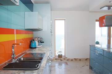 Lovely colours enhance the kitchen-area.