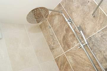 Both showers have monsoon showerheads.