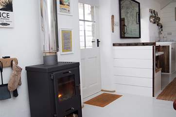 The living accommodation is set around the wood-burner.