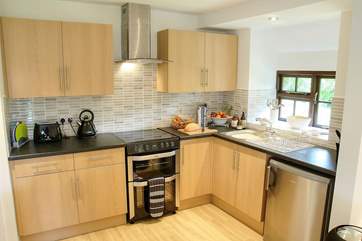 The well-equipped kitchen in Hendre Cottage.