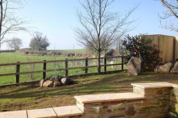 The patio at the rear of Tregantle has views over the countryside.