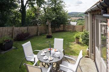 The sheltered garden at the rear of the cottage has fabulous views.