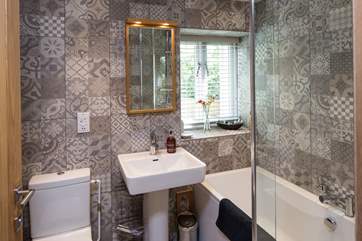 The stylish bathroom has luxurious toiletries perfect for holiday pampering.