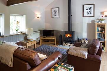 The cosy wood-burner has a very generous supply of logs.