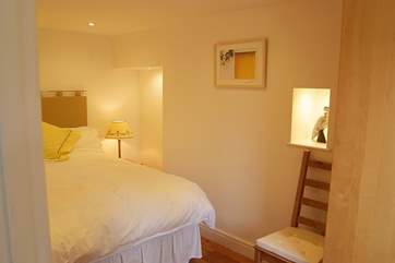 The pretty bedroom is a calm sanctuary.