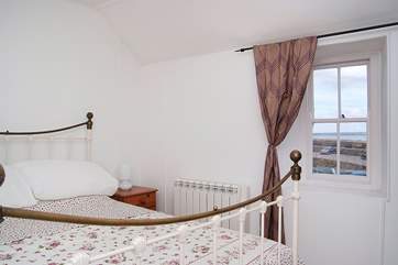 The double bedroom has lovely views across the harbour.