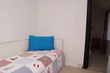 The single bedroom is furnished with a day bed (this room leads to the double bedroom).