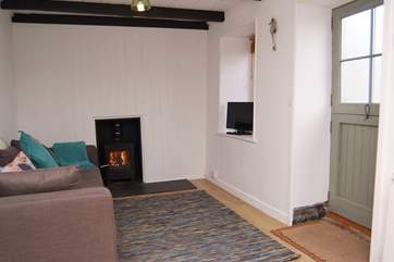 The living area has a wood-burner.