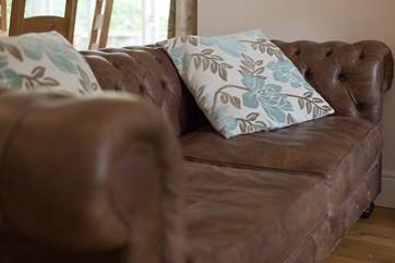 Sink into this Chesterfield sofa and put your feet up after a day out exploring the Exmoor National Park.