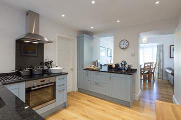 A super contemporary kitchen makes use of some original features to link into the rest of the living space.