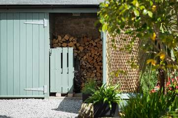 The log-store to the rear of the cottage, your first basket by the fire is complimentary.