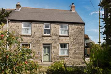 This pretty cottage 'Old Walls Cottage' has a Cornish name on the front Fosow Koth.