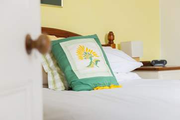 The comfy double bedroom overlooks the village.