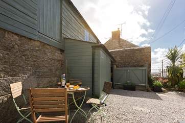 You can walk around the back of the cottage through the parking-area.