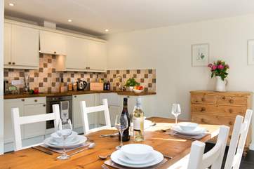 The country-style kitchen dining-area is fitting of its surroundings.