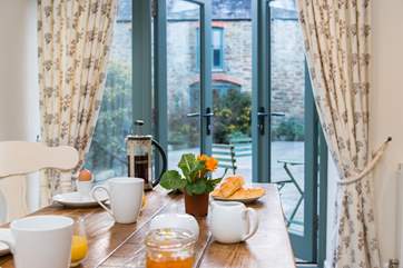 Mealtimes can be enjoyed looking out onto the courtyard.