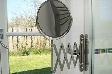 The shower-room looks out over lawns.