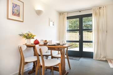 The light floods into the dining area