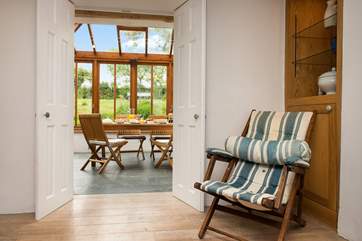 From the sitting-area, step down to the conservatory.