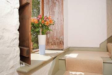 Deep windowsills and the original wooden shutters add to the lovely atmosphere here.