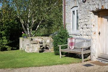There is seating at the front of the Hayloft and also around the corner of the building where there is another little grassy area for guests.