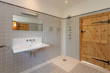 The shower is wet-room style - this is a very spacious room.