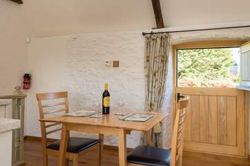 Back upstairs the dining-table fits well alongside the kitchen.