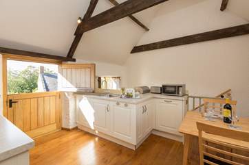 The original shuttered windows open wide so that you can take in the views over the farmstead and farmhouse to the front.
