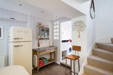 There is a utility-area leading off the kitchen and out to the back door.