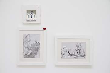 E H Shepard's drawings of Christopher Robin and Winnie the Pooh.