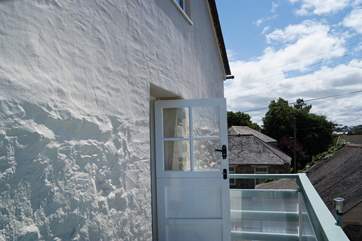 Step out from the living-room onto the balcony.