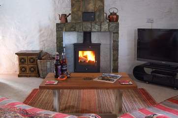 The fireplace is a real feature of this superb sitting-room.