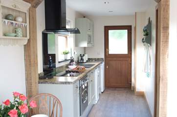 The kitchen is not only well-equipped but very stylish.