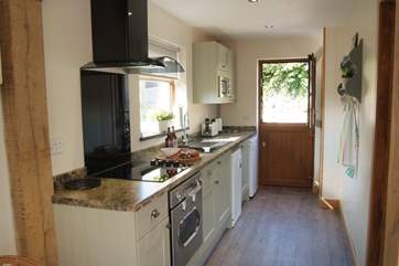The stylish kitchen now has a dishwasher.