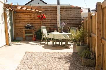 Your private patio is a real sun-trap and there is a gas barbecue and lockable bike/surfboard store.