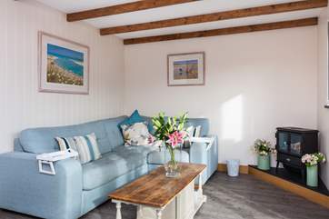 The open plan living-room has a very comfy corner sofa.