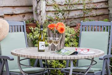 The sunny patio is the perfect spot for a glass of wine.