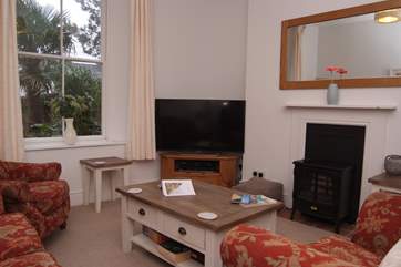 The sitting-room has an electric wood-burner effect stove.