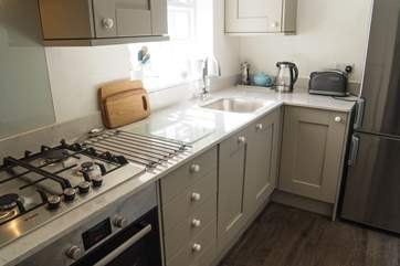 Granite work surfaces and top quality appliances show the level of care taken to fit the cottage out.