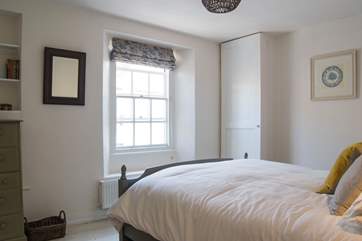The main bedroom looks out over the lane.
