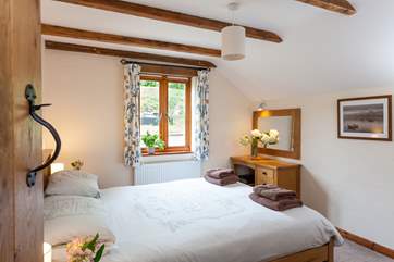 The master bedroom with 5' double bed is next door to the bathroom.