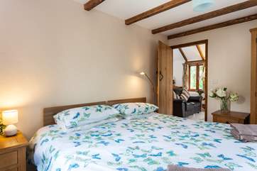 The two bedrooms and bathroom are all accessed from the central living-room.