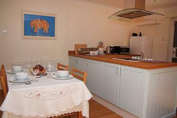 The cook can chat to everyone over the breakfast-bar.
